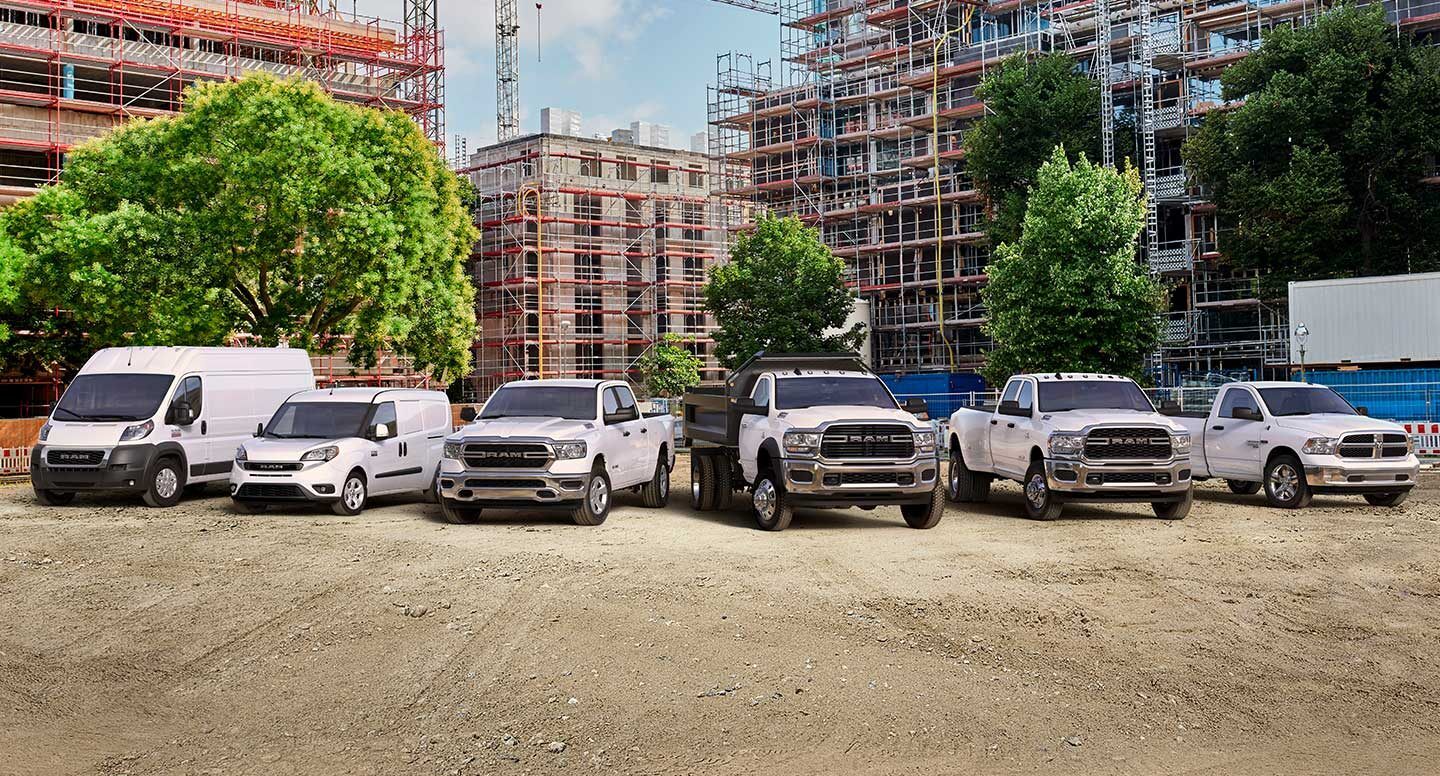 Display 2021 Ram Vehicles parking near a construction site.