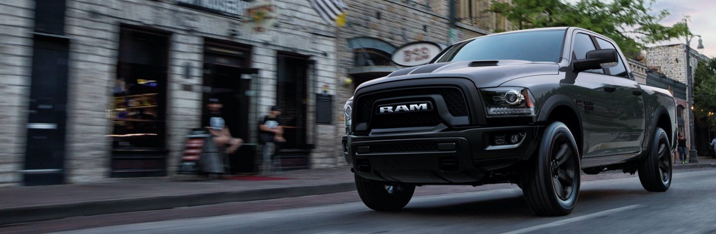 The 2022 Ram 1500 Classic Warlock being driven on a city street.